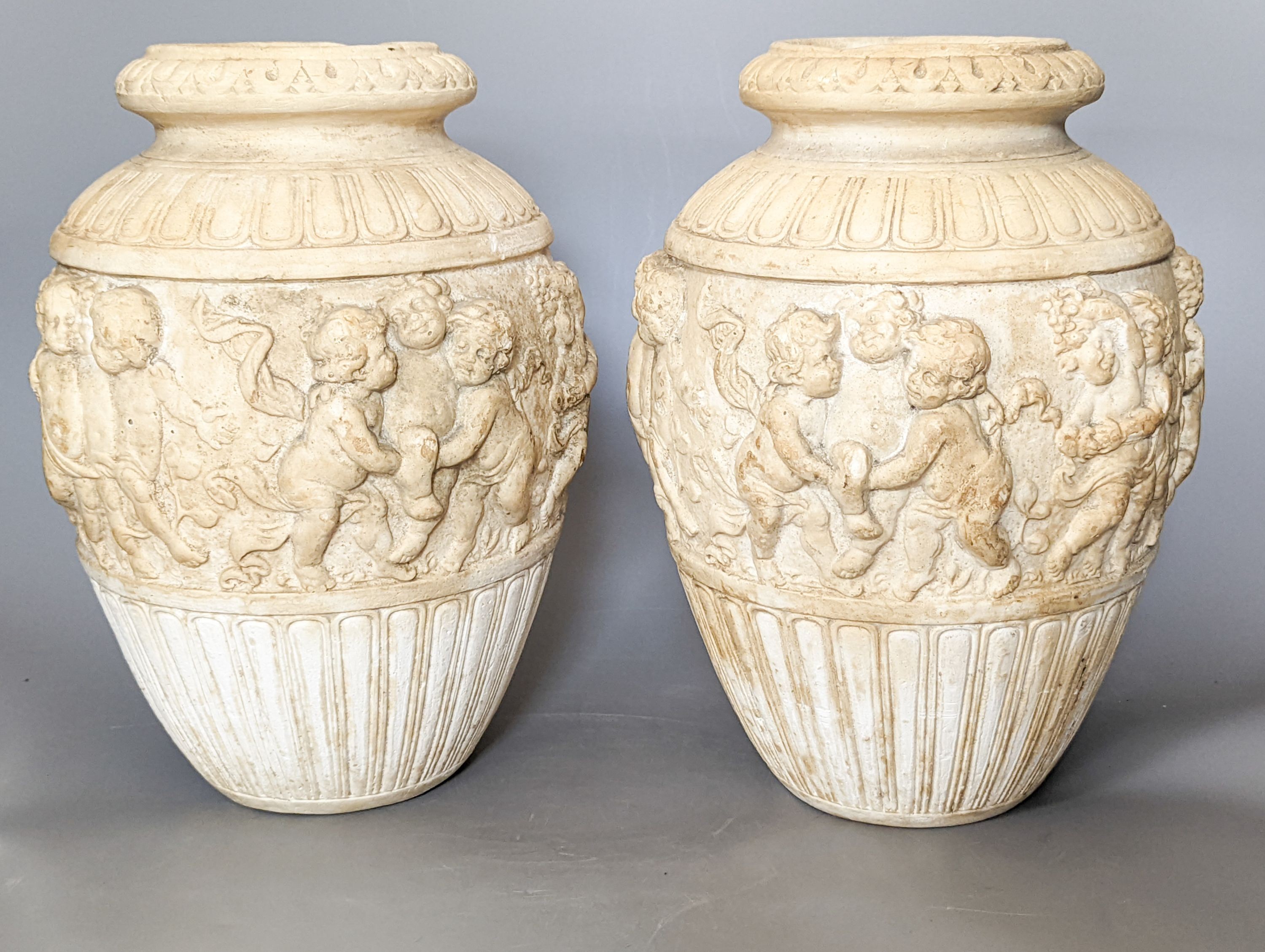 A pair of 19th century earthenware vases moulded in Italian renaissance style 30cm